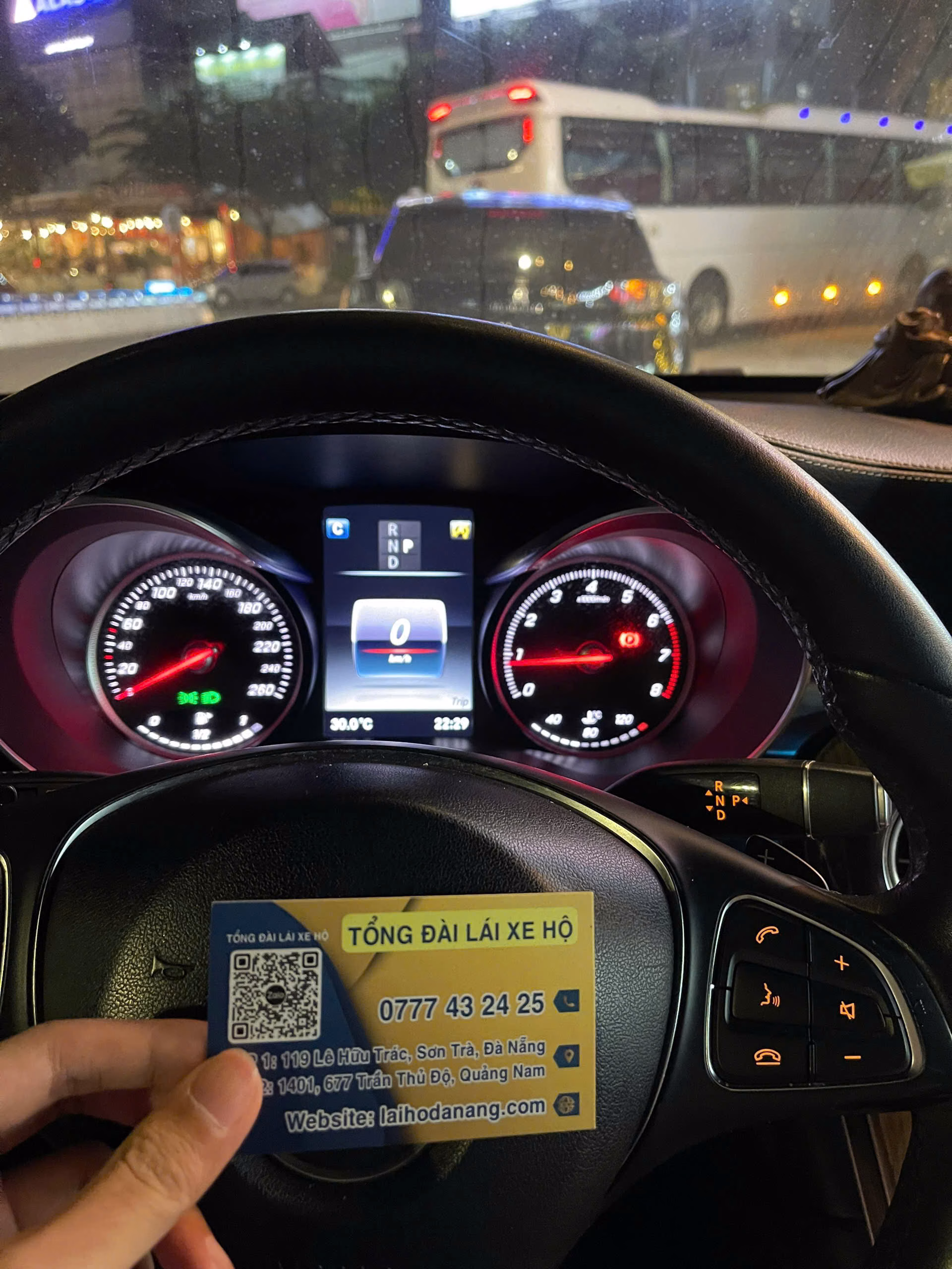 Man driving a luxury car safely at night, professional designated driver, city lights background, realistic.